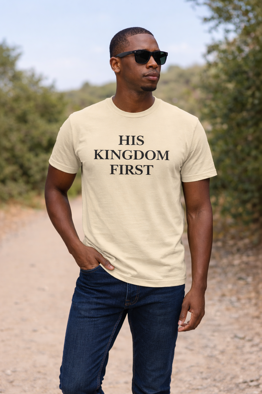 His Kingdom First Christian t-shirt in cream worn by a man outdoors
