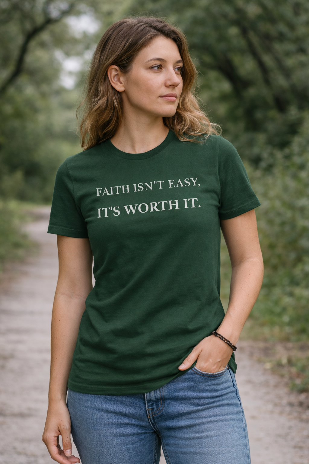 Faith Isn't Easy It's Worth It Christian t-shirt in forest green worn by a woman outdoors

