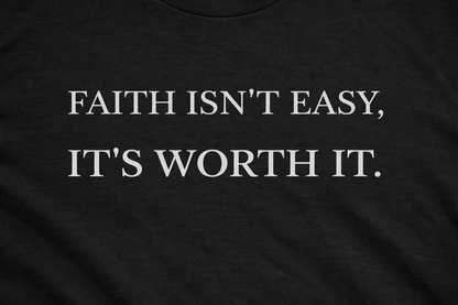 Close-up of “Faith Isn't Easy It's Worth It” print on black Christian t-shirt
